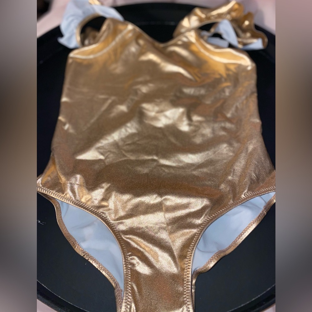 Never worn girl 11-12 gold one piece bathing suit